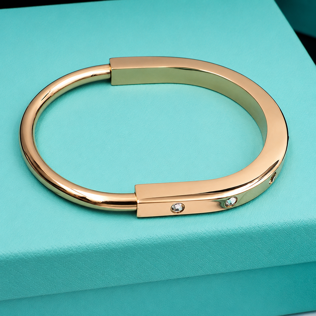 T Lock Bangle Bracelet in a Timeless Design