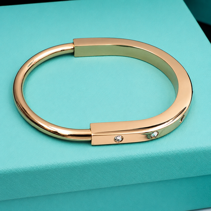 T Lock Bangle Bracelet in a Timeless Design