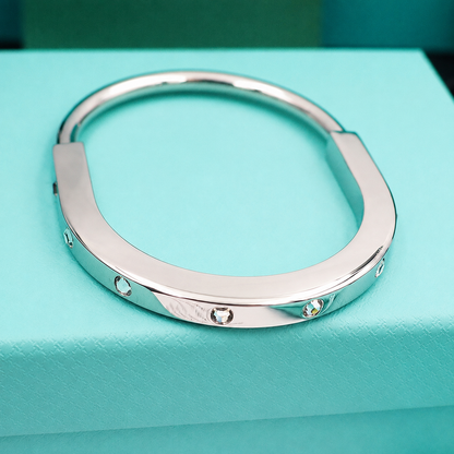 T Lock Bangle Bracelet in a Timeless Design