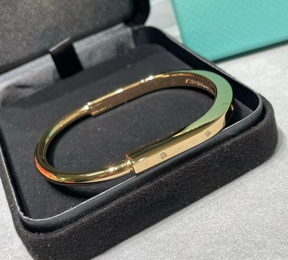 T Lock Bangle Bracelet in a Timeless Design