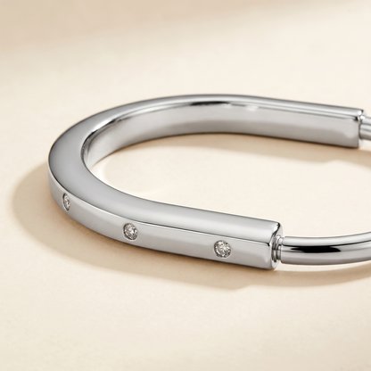 T Lock Bangle Bracelet in a Timeless Design